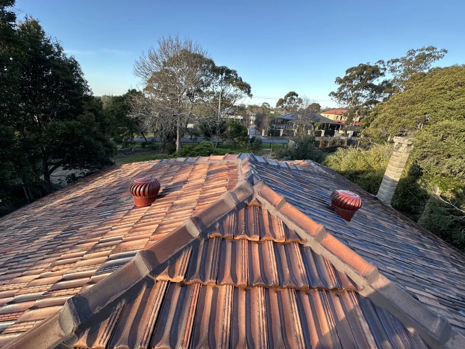 Roofing contractor completing a professional tile roof restoration in Frankston — quality workmanship