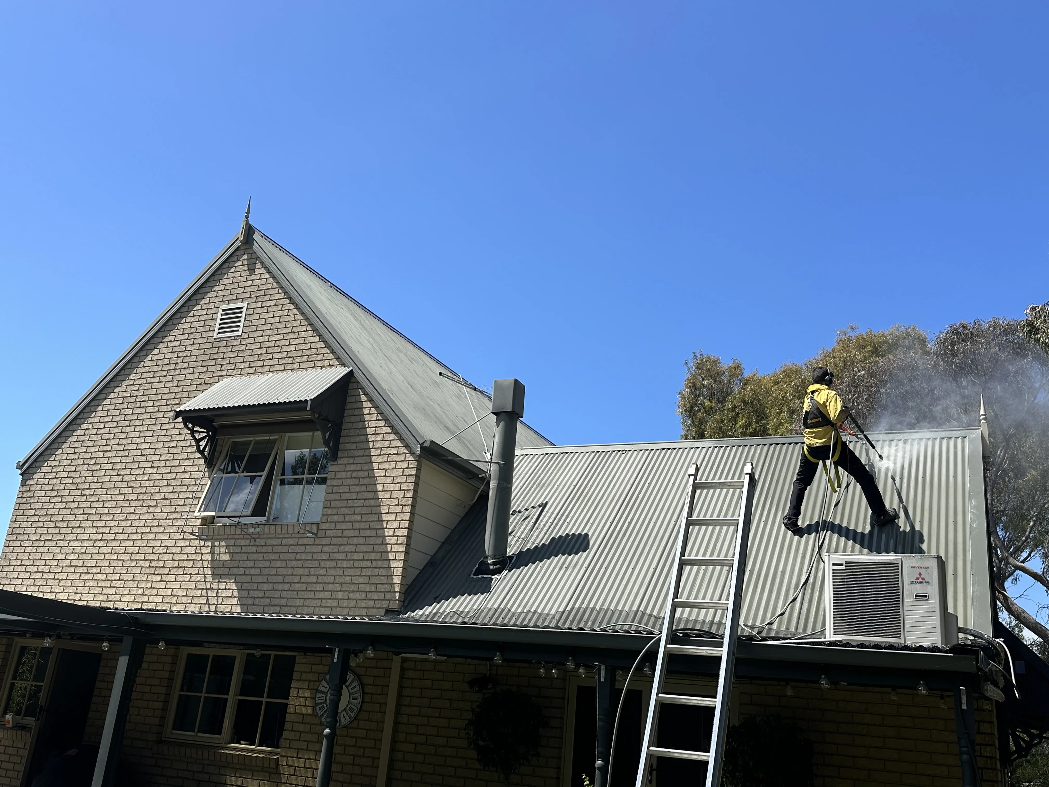 Mike Umarov working on a Peninsula roof restoration project